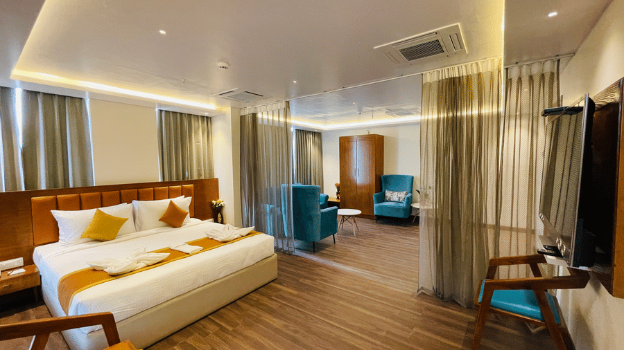 Elegant suite room with cosy bed and modern décor at Quality Inn Rockwell Grand, Bangalore.