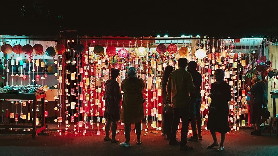 Group of people indulging in street shopping