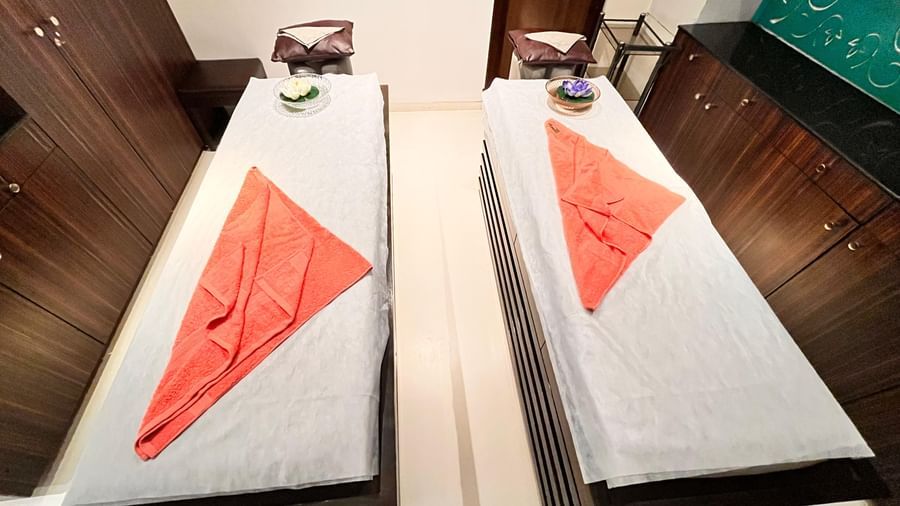 A couple of massage beds placed next to each other with towels lain on the sheet at Springs Hotel & Spa, Bangalore