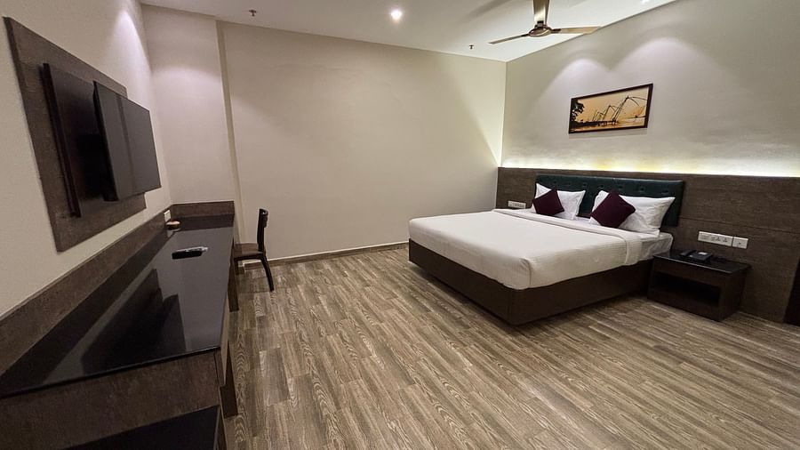 Luxury Suite featuring a king size bed surrounded by simple decor. - Still Waters, Varkala