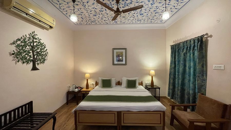Double bed at Deluxe Double with pretty stickers on the walls and roofs at Suryaa Villa Jaipur