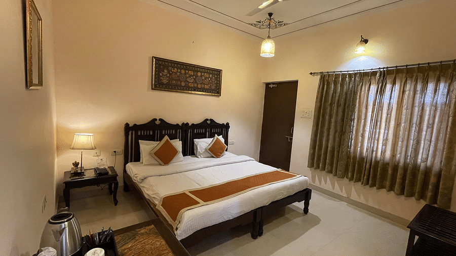Double bed at Deluxe Double with pretty stickers on the walls and roofs at Suryaa Villa Jaipur
