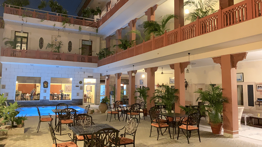 Seating arrangement at Poolside Courtyard Dining at Suryaa Villa Jaipur