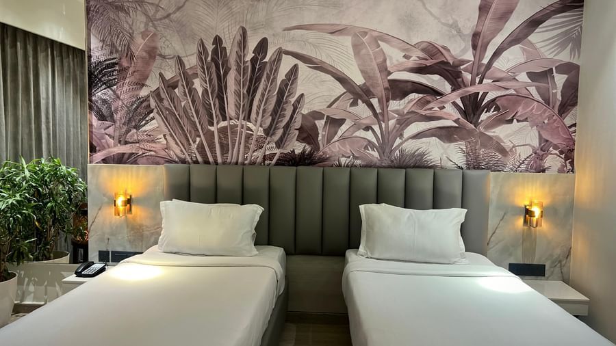 Picture featuring interior of room with a two cozy beds - The Hans Hotel Hubli