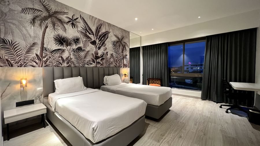Picture featuring interior of room with a two cozy beds - The Hans Hotel Hubli