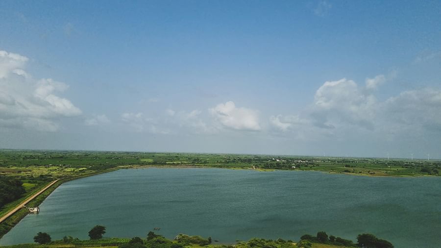 A large lake with greenery surrounding it in Rafudad Moti, Jamnagar.