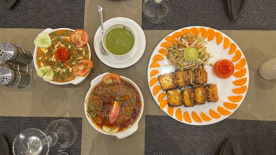 Many items on teh table at aromas restaurant - VITS Jamnagar, Mithoi
