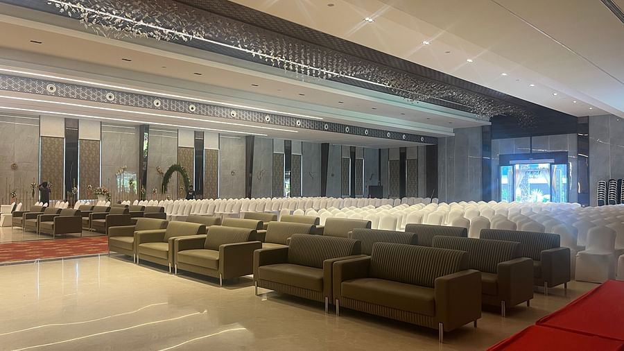 Elegant wedding stage with floral arrangements and drapes  | VRR Astoria Hotel and Conventional Centre