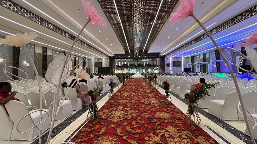 Festive wedding stage with colorful drapes and lighting.  | VRR Astoria Hotel and Conventional Centre