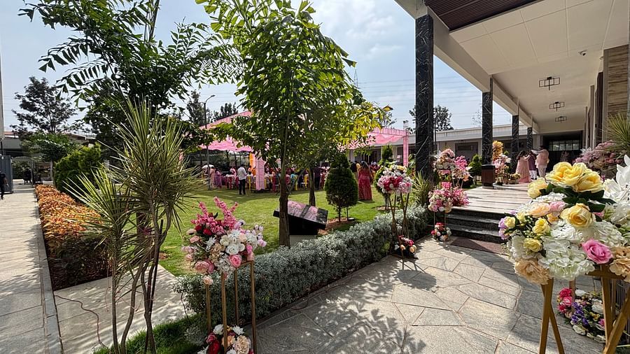 Elegant Outdoor Entrance with Floral Decorations and Greenery