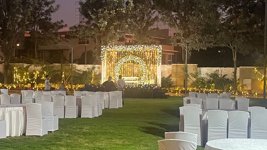 Modern stage with LED lights and floral arrangements  | VRR Astoria Hotel and Conventional Centre