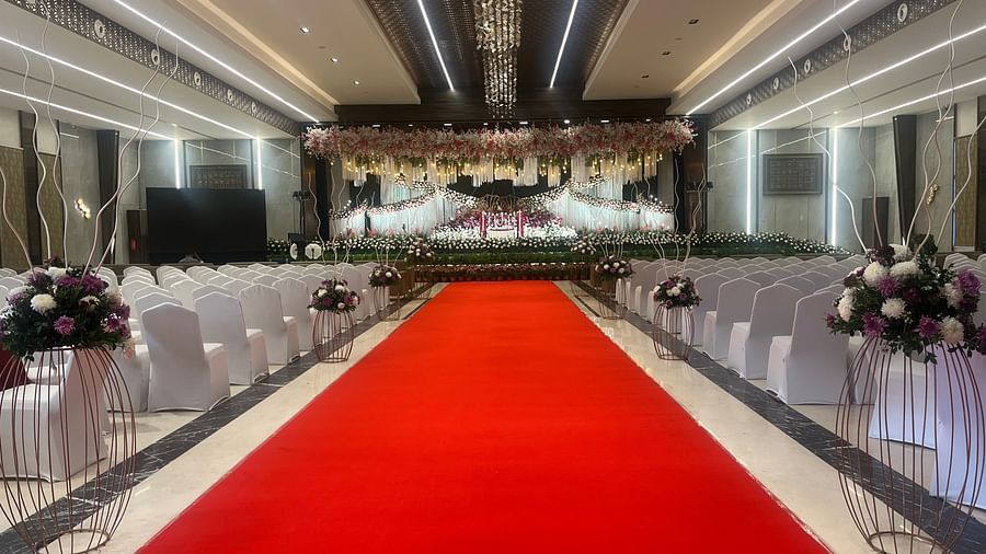 Modern wedding stage with LED lights and floral arrangements  | VRR Astoria Hotel and Conventional Centre