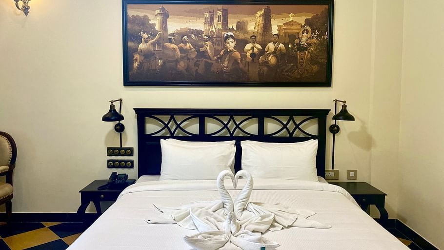 bed with swan towel art