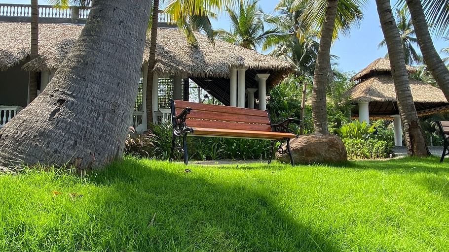 bench on lawn at lagoon De Pondy