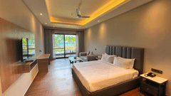 Spacious bedroom with a king size bed in the Superior Ocean View Room at Silver Sand Sea Princess Beach Resort, Port Blair
