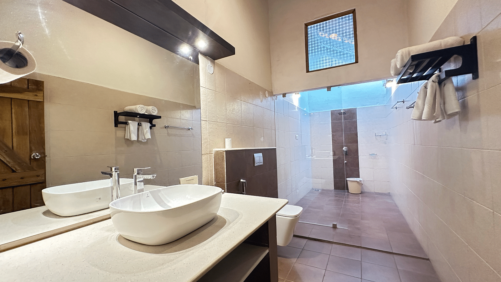 a bathroom with a washbasin and a western style toilet - Kadkani River Resort, Coorg
