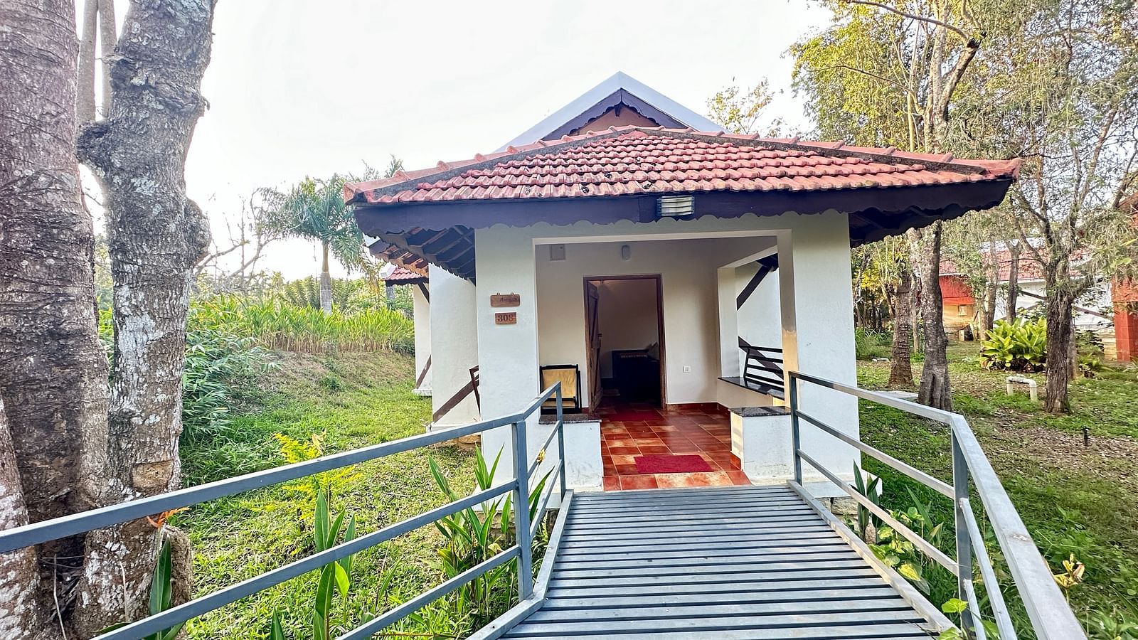 entrance to the property with steps leading up to the entrance - Kadkani River Resort, Coorg