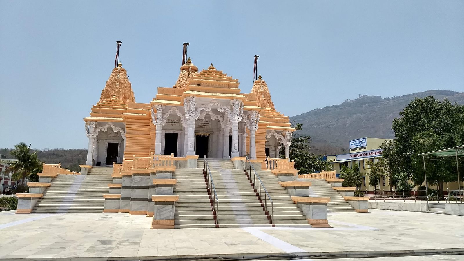 facade of a temple in lonavala with blue sky in the background