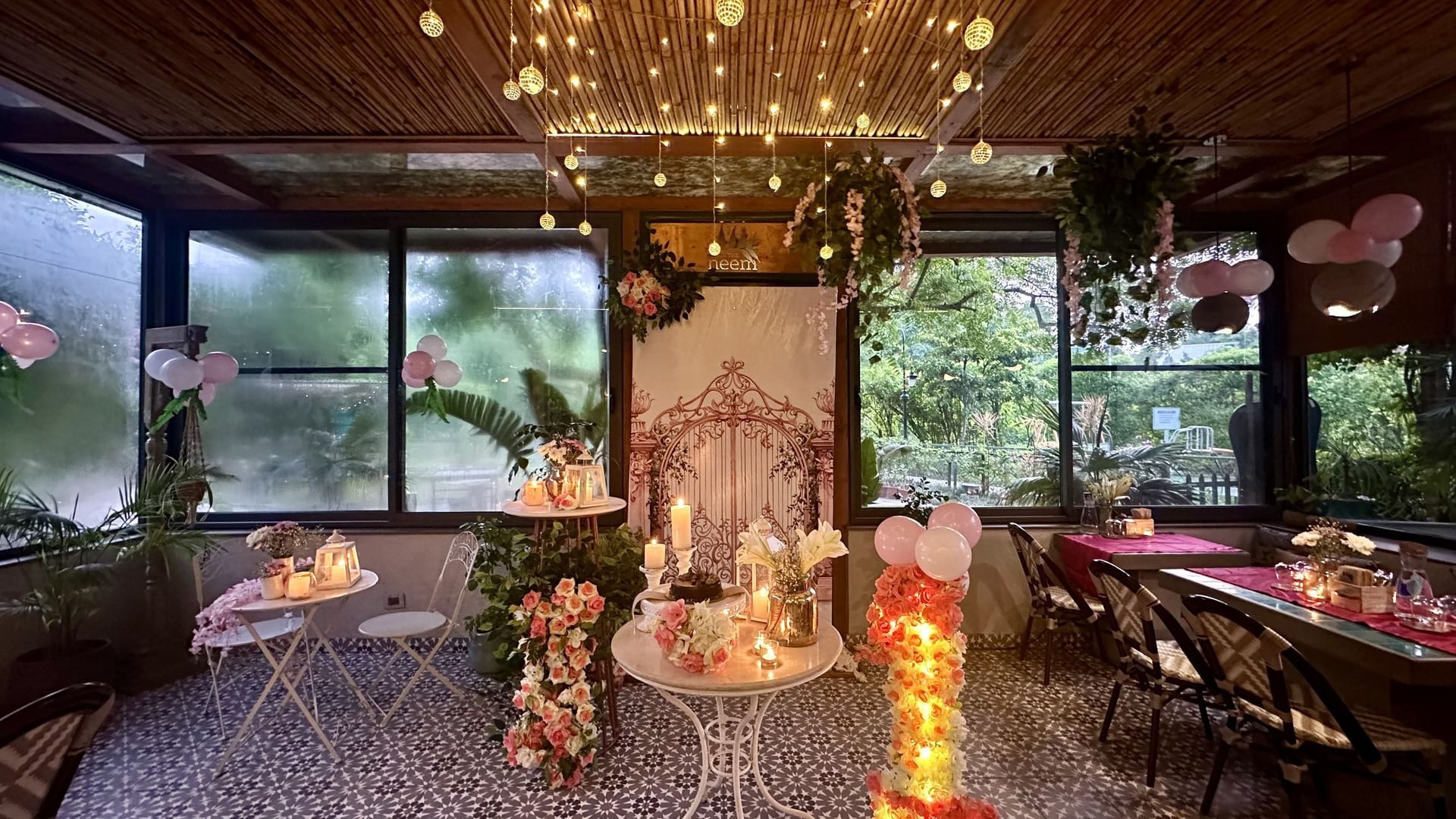 Elegant indoor dining area with floral décor and glowing lights at Karma Chalets.