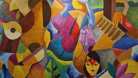An overview of an abstract painting with a spotlight on it.