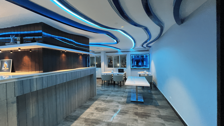Elegant lounge-style bar space with premium interiors at Alps Residency, Krishnagiri.