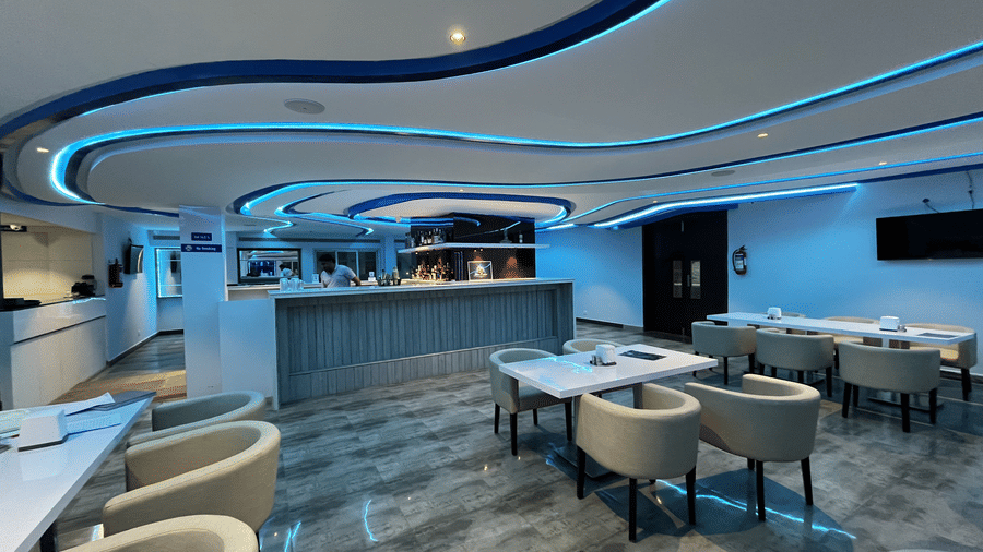 Spacious bar and lounge area with comfortable seating at Alps Residency, Krishnagiri.