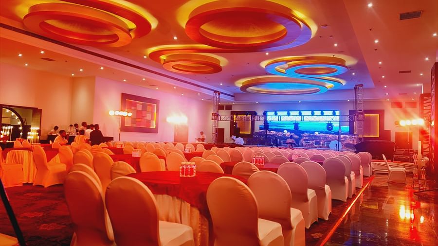 A banquet hall with rows of chairs and tables set for an event. - Bamboo Saa Resort & Spa, Udaipur