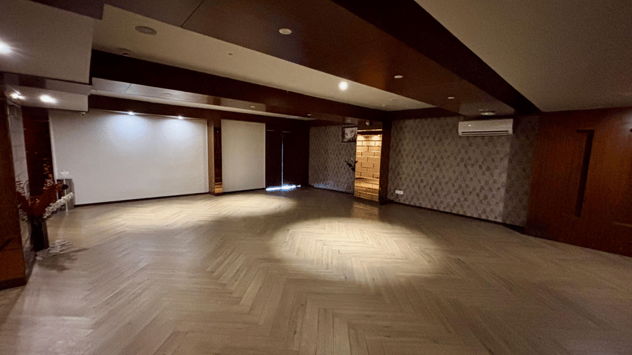 Jashan Hall at Best Western Plus Revanta Resort & Spa showing a spacious interior with ceiling lights and polished floors.