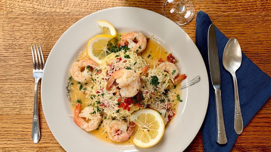 A vibrant breakfast plate with fresh fruits and shrimp - Brewery Gulch Inn & Spa