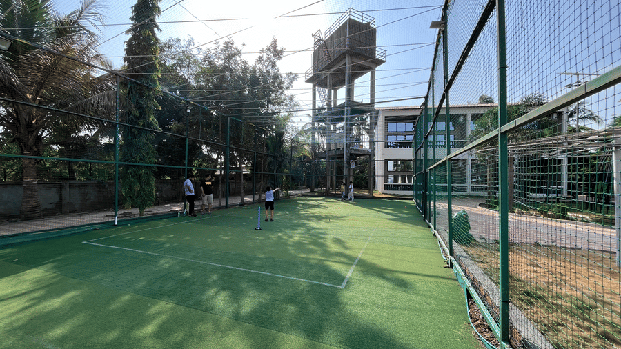 Enclosed green multi-purpose sports turf for cricket and football - DAN Resorts & Weddings, Palghar