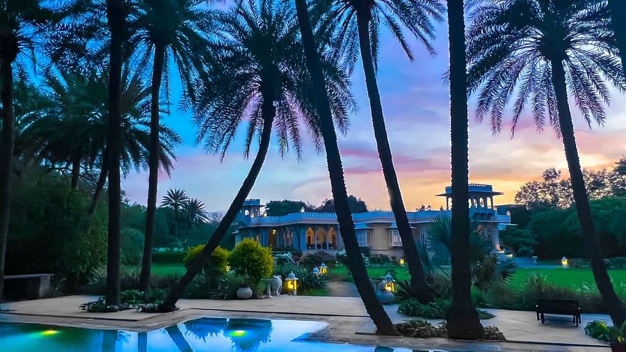 image of the swimming pool at Dev Shree, Deogarh with a picturesque background