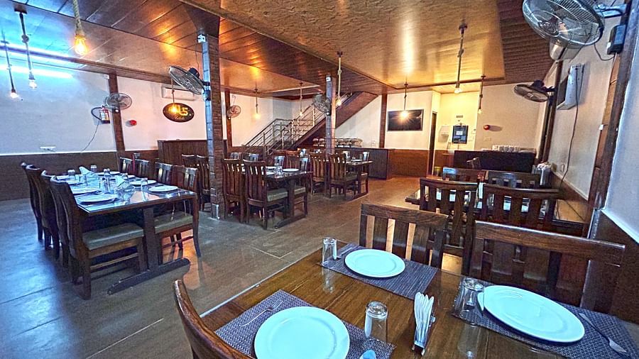 Dining area of the in-house restaurant at DLS MJ River Resort, Rishikesh.
