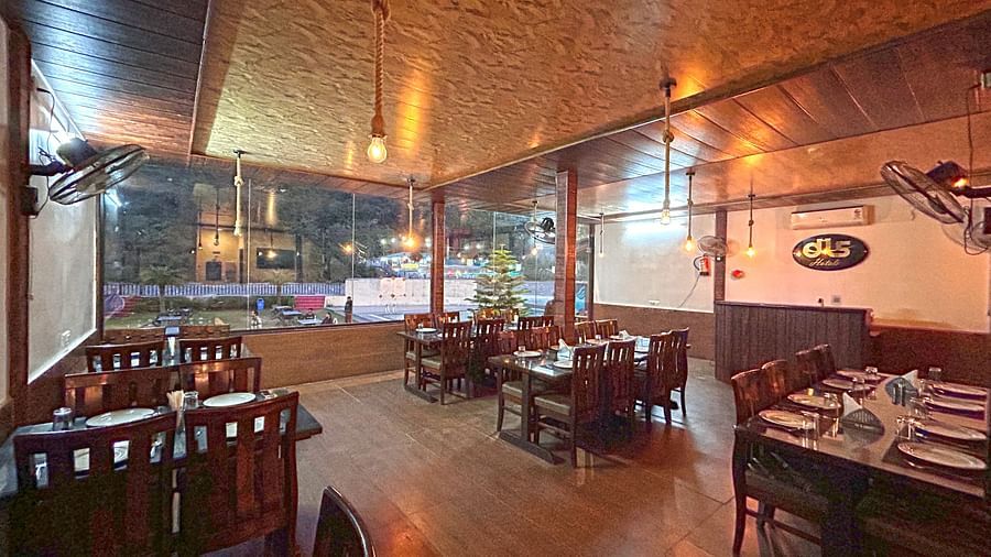 Dining area of the in-house restaurant at DLS MJ River Resort, Rishikesh.