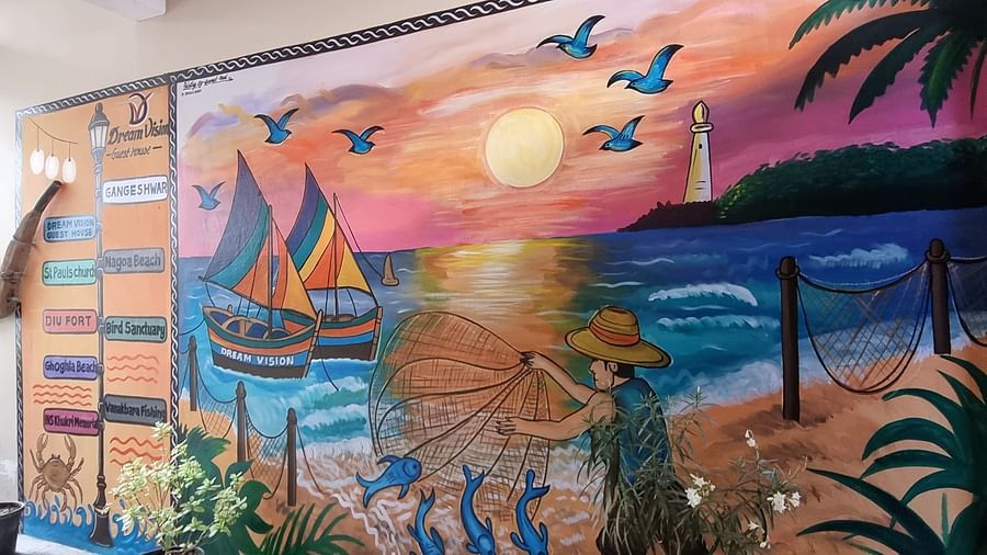 A beautiful wall mural depicting a fisherman spreading his net in the ocean at Dream Vision Guest House.