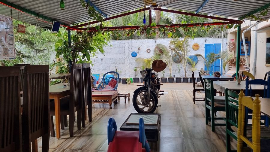 Front view of the common seating area with a silhouette of a motorcycle in the middle at the Dream Vision Guest House.