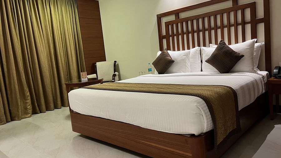 A side angle image of the suite with the king size bed.