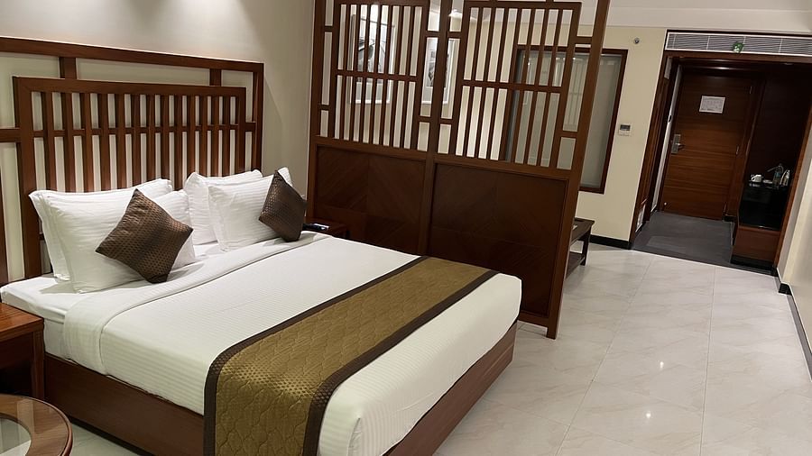 A side angle view of the suite  with the divider separating the seating area..