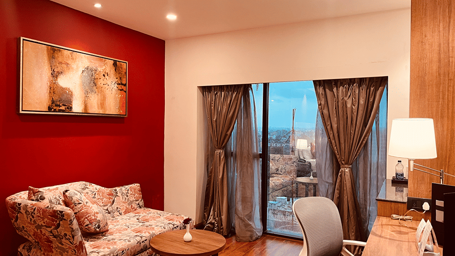 Corner view of the separate living area with the beautiful city landscape overlooking from the huge windows at Senses Hotel. 