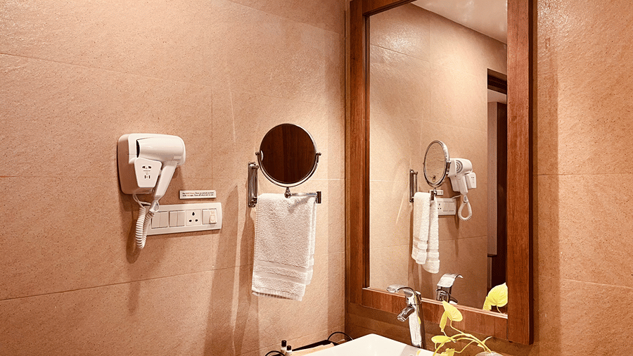 A close up shot of the vanity area with a rectangular mirror at the Senses Hotel.