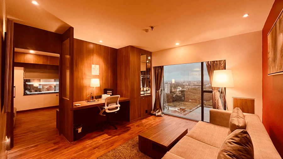 The separate living area at the Premium Smart Suite with warm ambient lighting at the Senses Hotel.