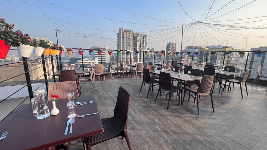 Morning rooftop dining setup with a scenic view - Senses Hotel