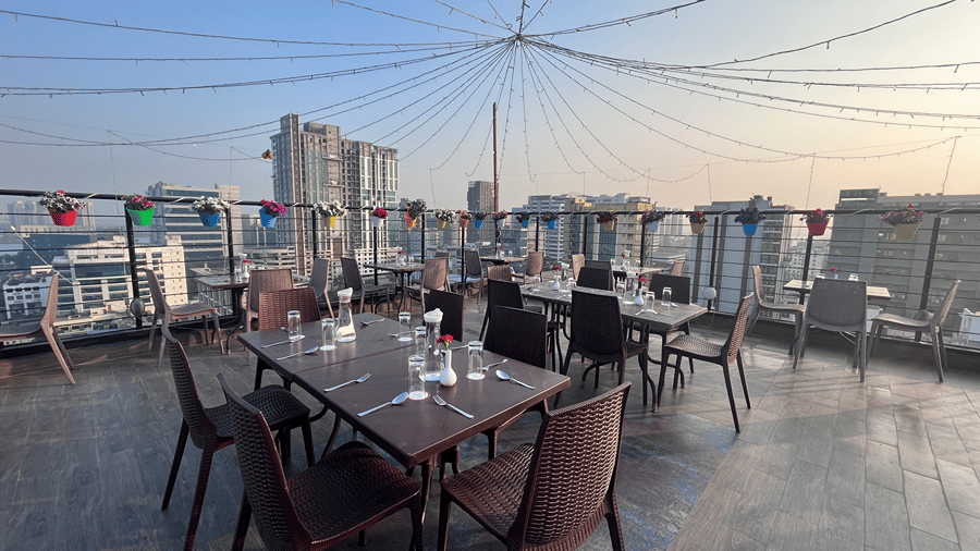 Rooftop dining setup with well arranged cutlery on the table - Senses Hotel