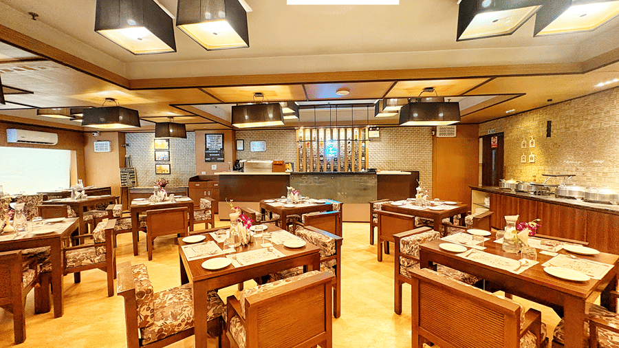The dining area at Hi Brew Restaurant with tables arranged properly.