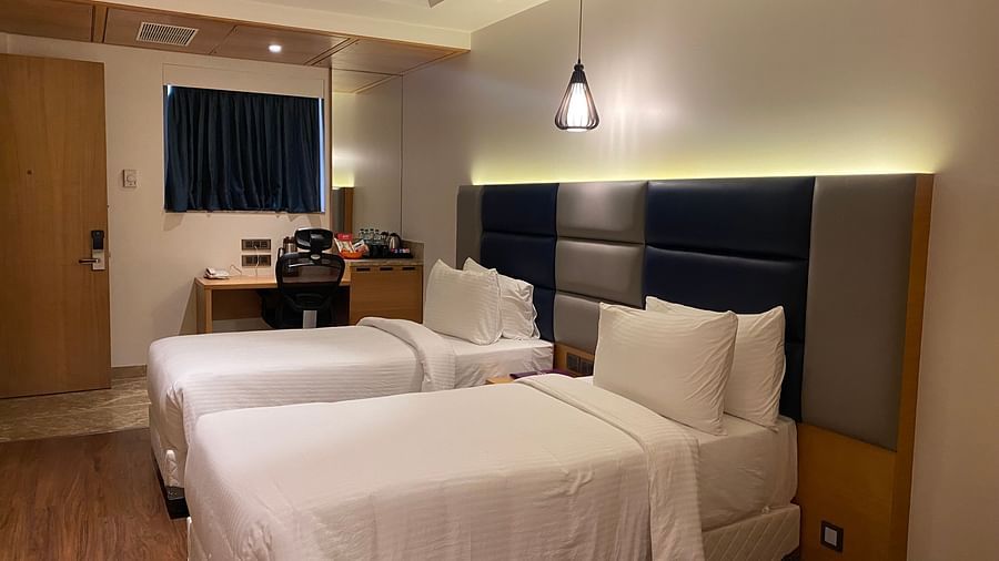 A premium twin room with comfy twin bed with a cosy and beautiful interior at SRM Hotel Maram Malai Nagar, Chennai