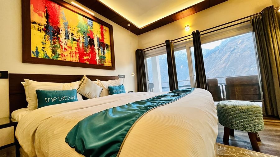 image of a double bed taken from a lower angle at the pent house - The Tattva Boutique Resort