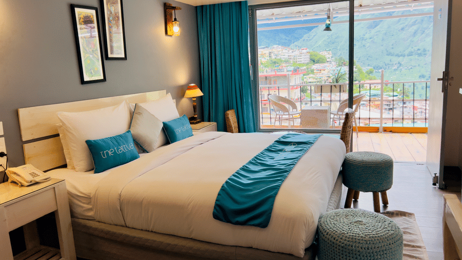 A plush double bed in the Premium Room overlooking the beautiful valley views - The Tattva, Joshimath