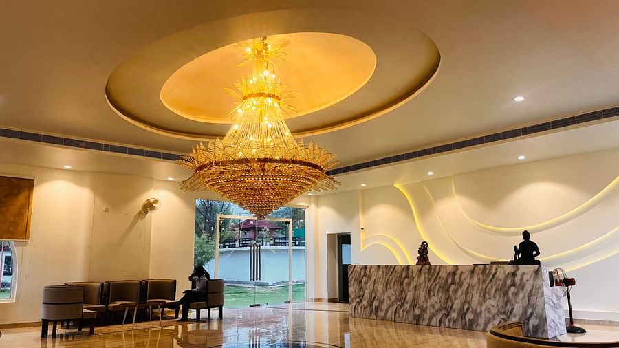 The lobby of Valley by Grassfield with a front desk and a seating area in the corner.