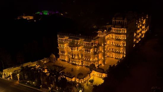 Aerial view of Chunda Hotels in the night with the lights on and darkness in the background