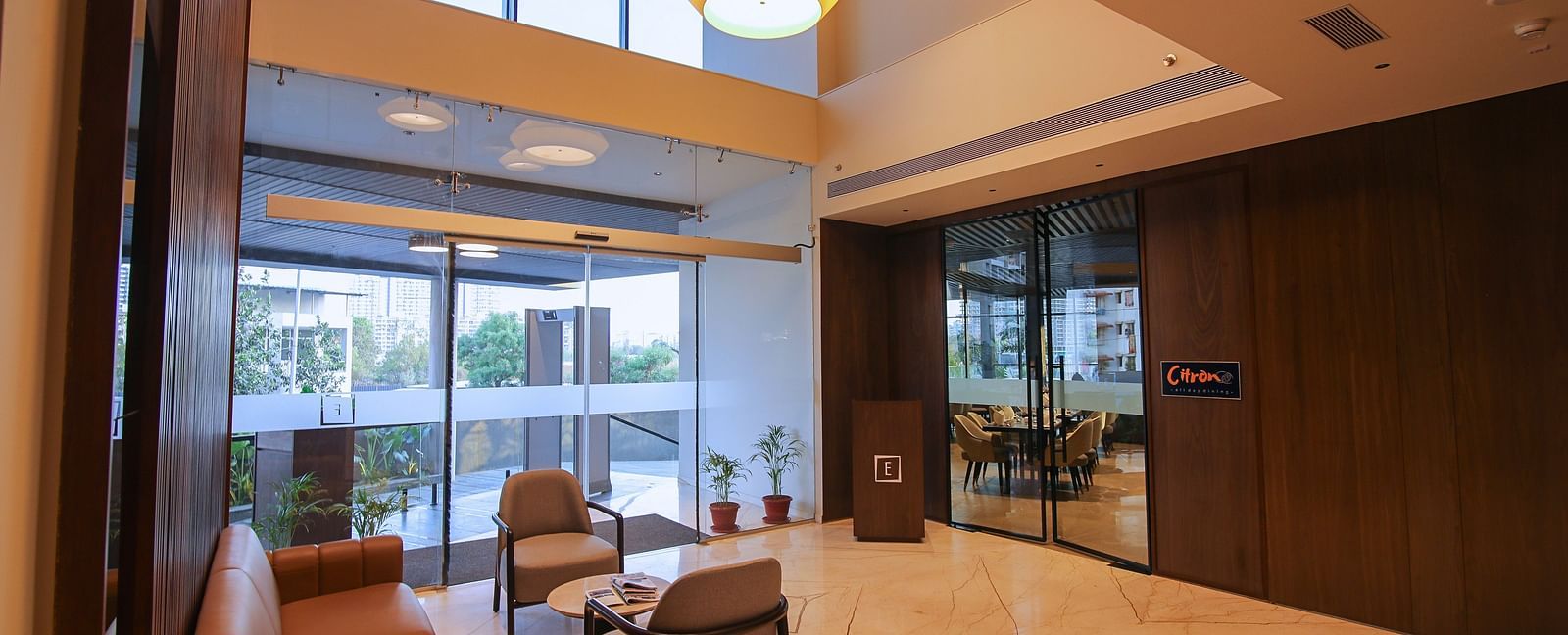 Overview of the Lobby area with comfortable seating at Essentia Premiere, Pune.