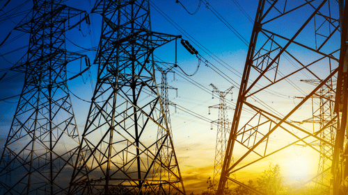 Electric power transmission towers at sunset – Power and Energy Kenya 2025 electricity infrastructure visual